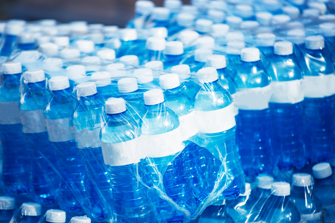 Bottled mineral water wrapped on plastic